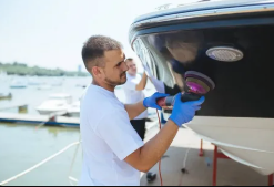 Marine detailing team preparing yacht surfaces and deck fittings